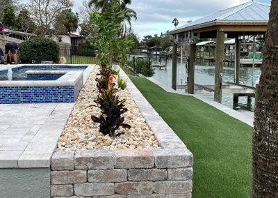 Landscaping Around Pool And Turf On Canal
