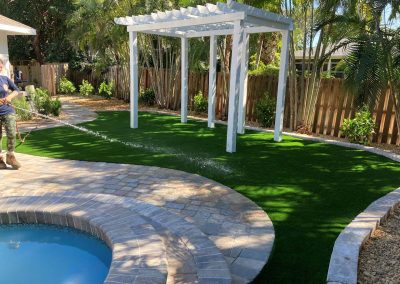 Watering Finished Turf And Landscaping Job White Arch